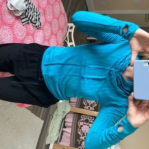 Fitting blue running jacket with high neck